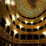 The pale blue, trompe-l'oeil ceiling that resembles a round cupola.